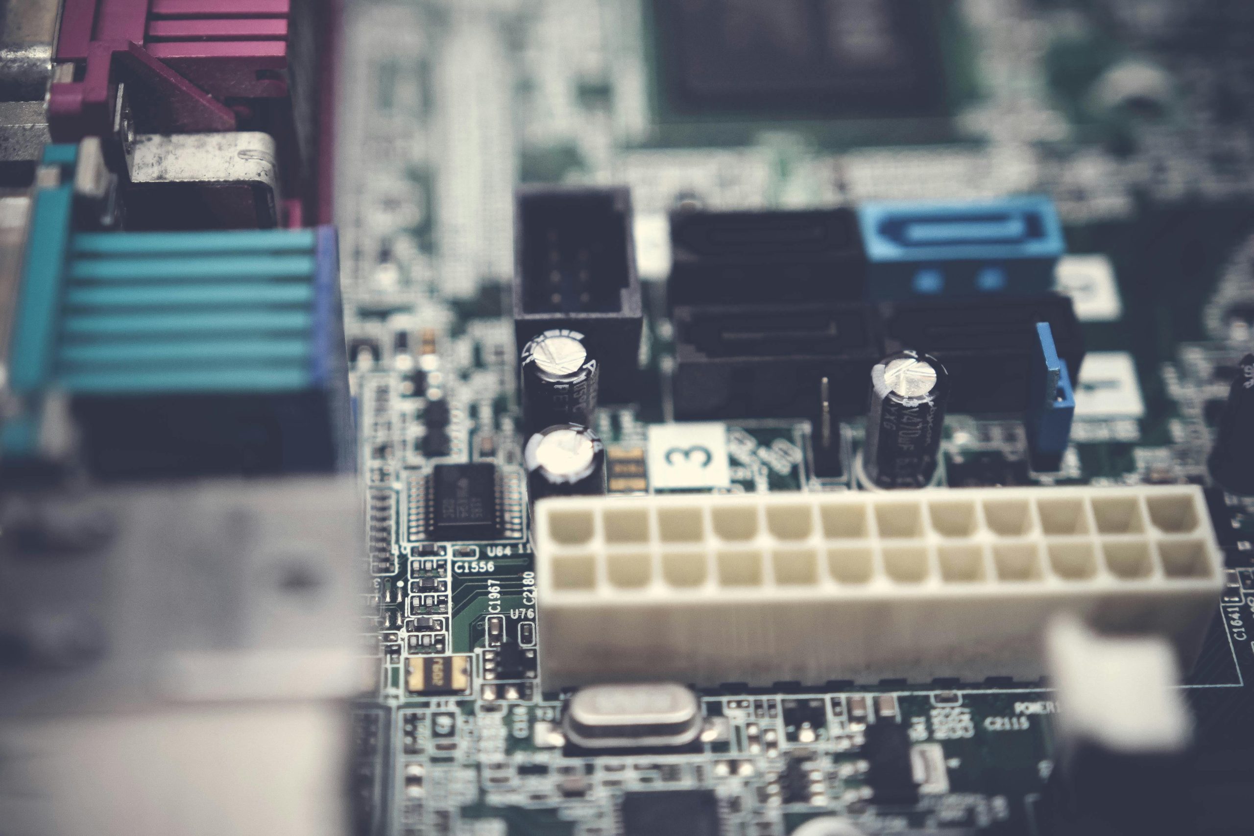 Detailed view of electronic components on a circuit board, showcasing modern technology.