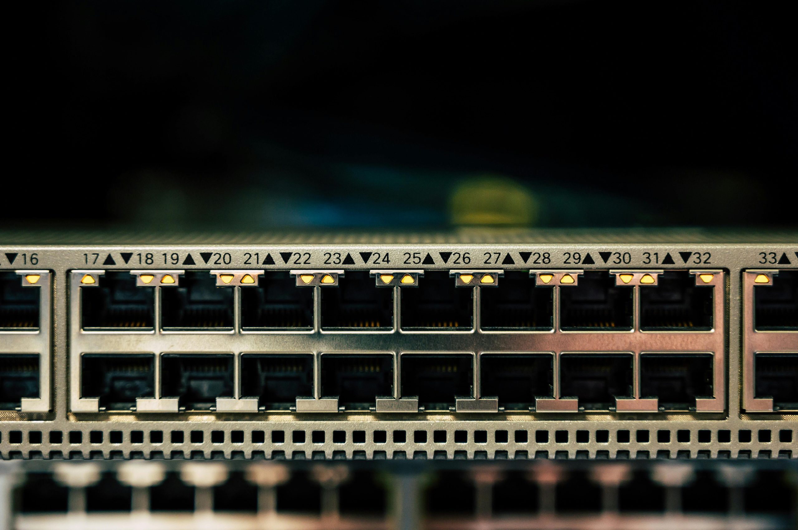 Detailed view of a network switch featuring multiple ethernet ports and LED indicators.