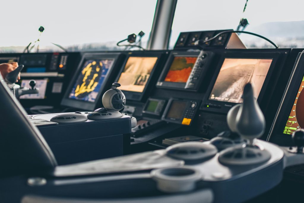 High-tech nautical cockpit showcasing advanced navigation systems and controls.